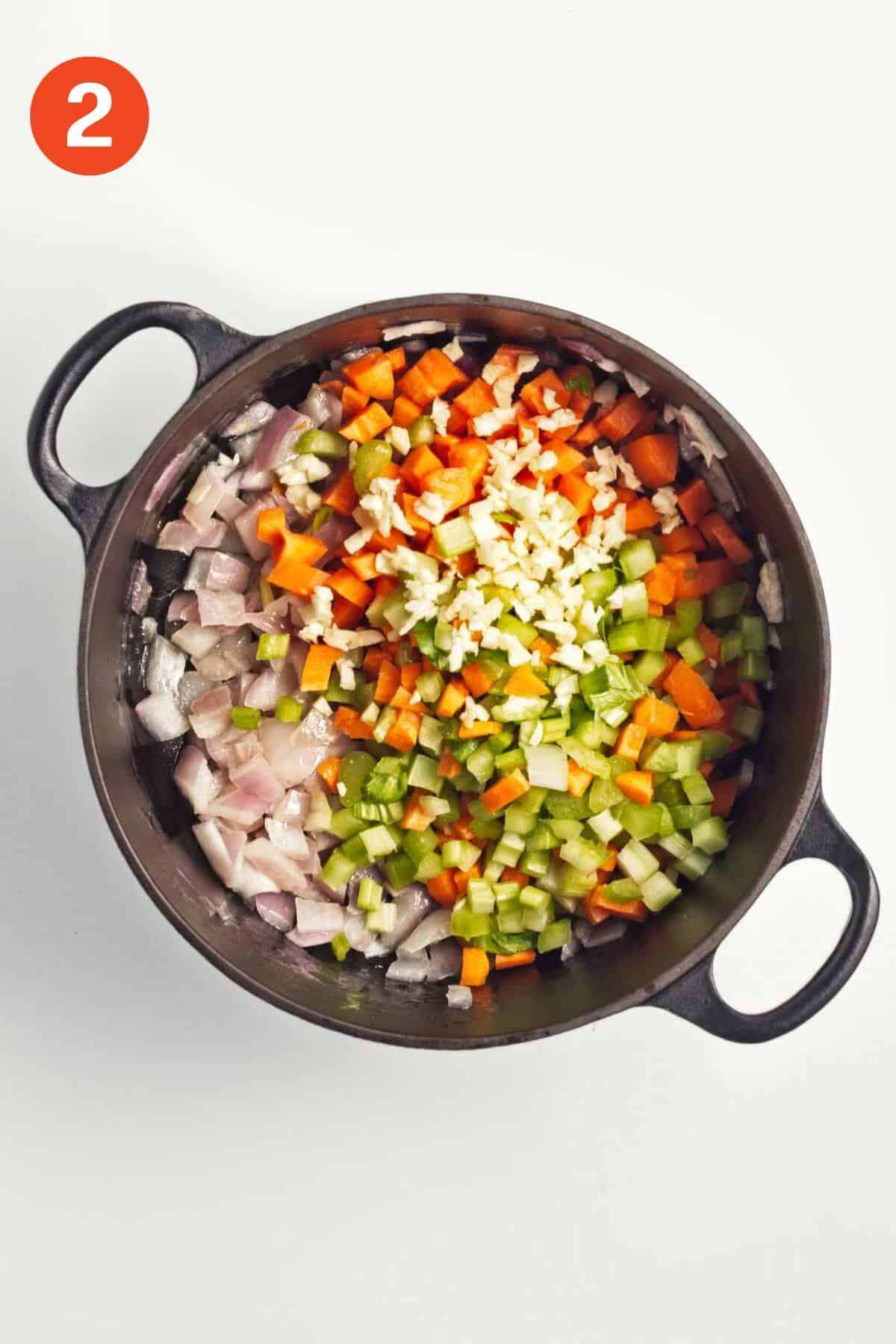 Other vegetables added to the pot with the cooked onions.