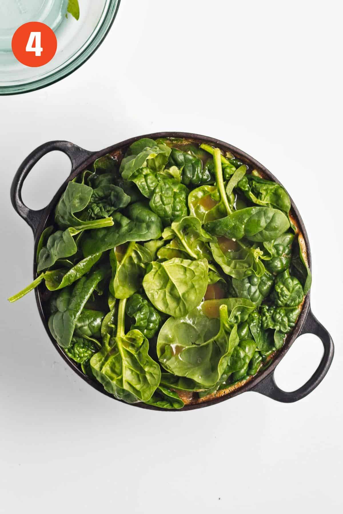 Fresh spinach added to the pot.