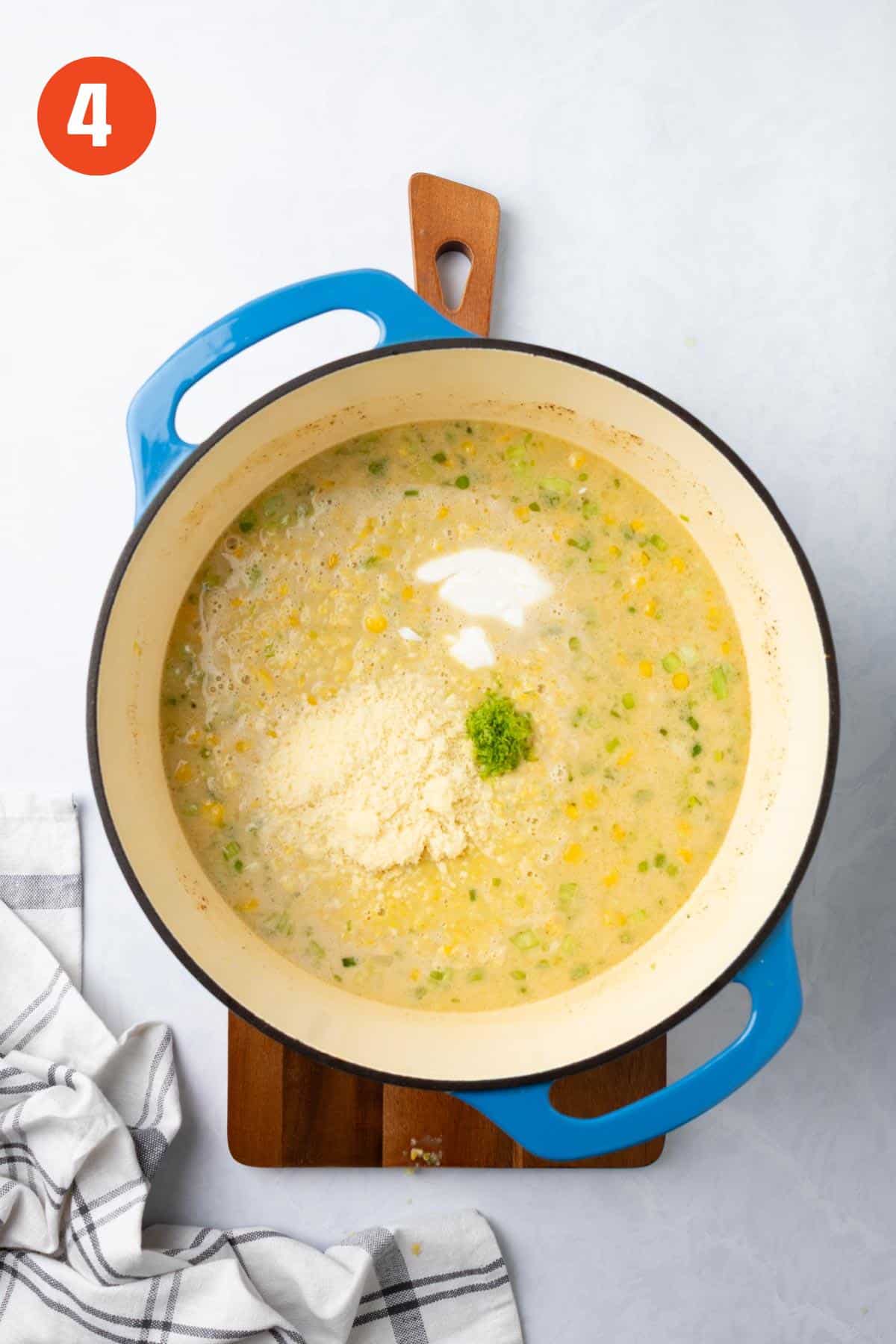 Mexican street corn chowder added back to the pot with cheese added.