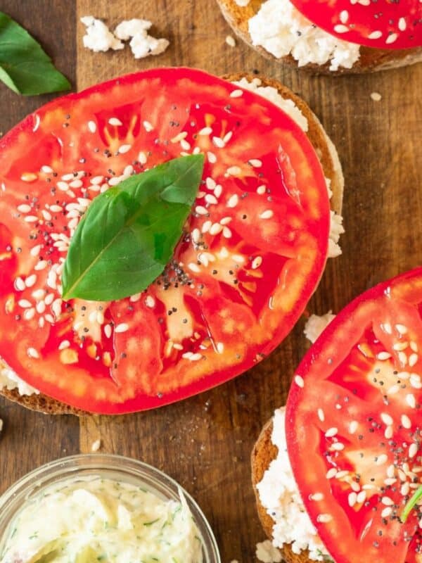 Ricotta toast with fresh tomato and basil on top.