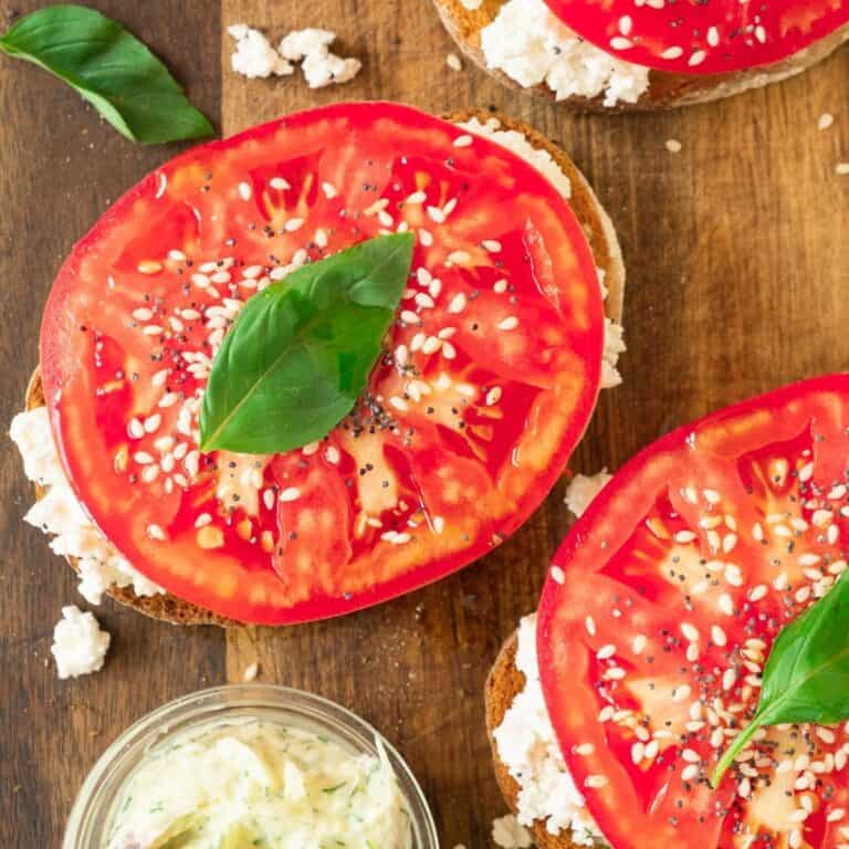 Ricotta toast with fresh tomato and basil on top.