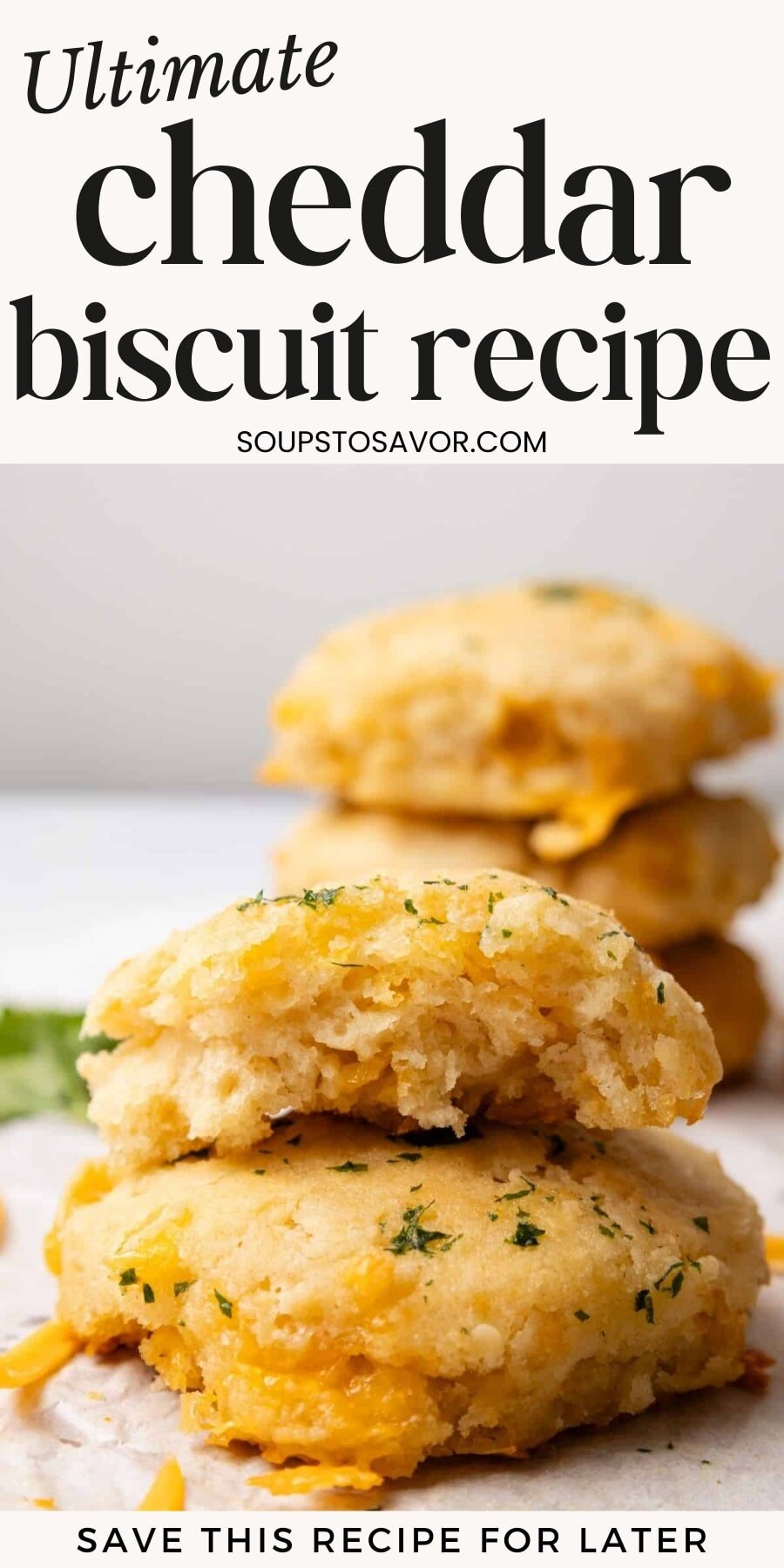 Pin for pinterest graphic with image of cheddar biscuits and text on top.
