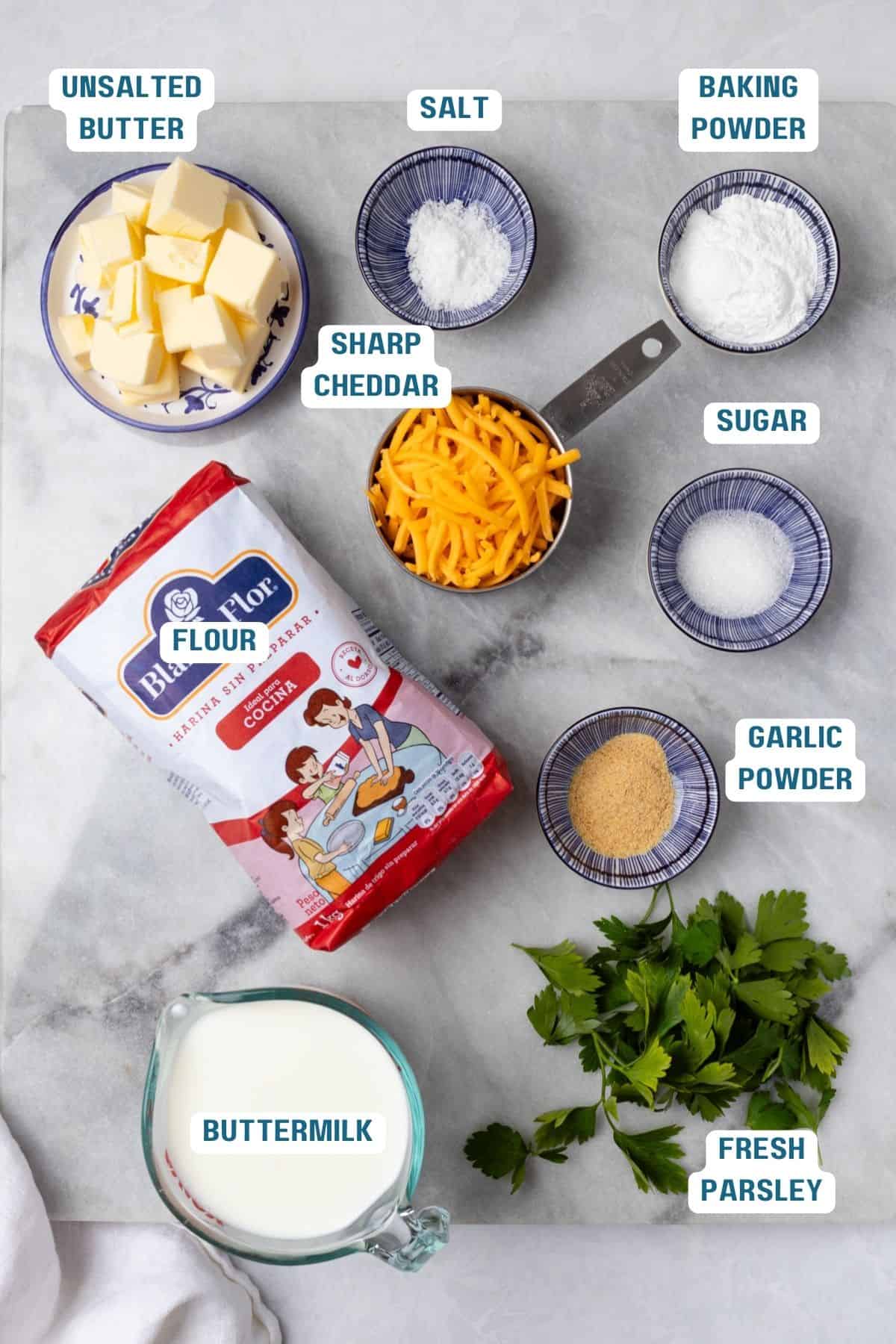 Ingredients to make cheddar cheese biscuits before mixing.