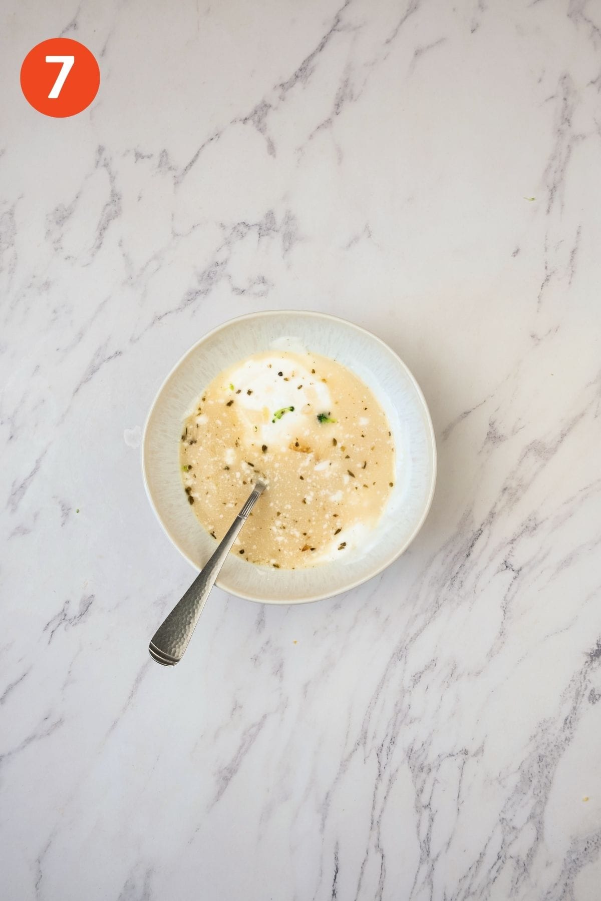 Flour and milk mixture in a bowl.