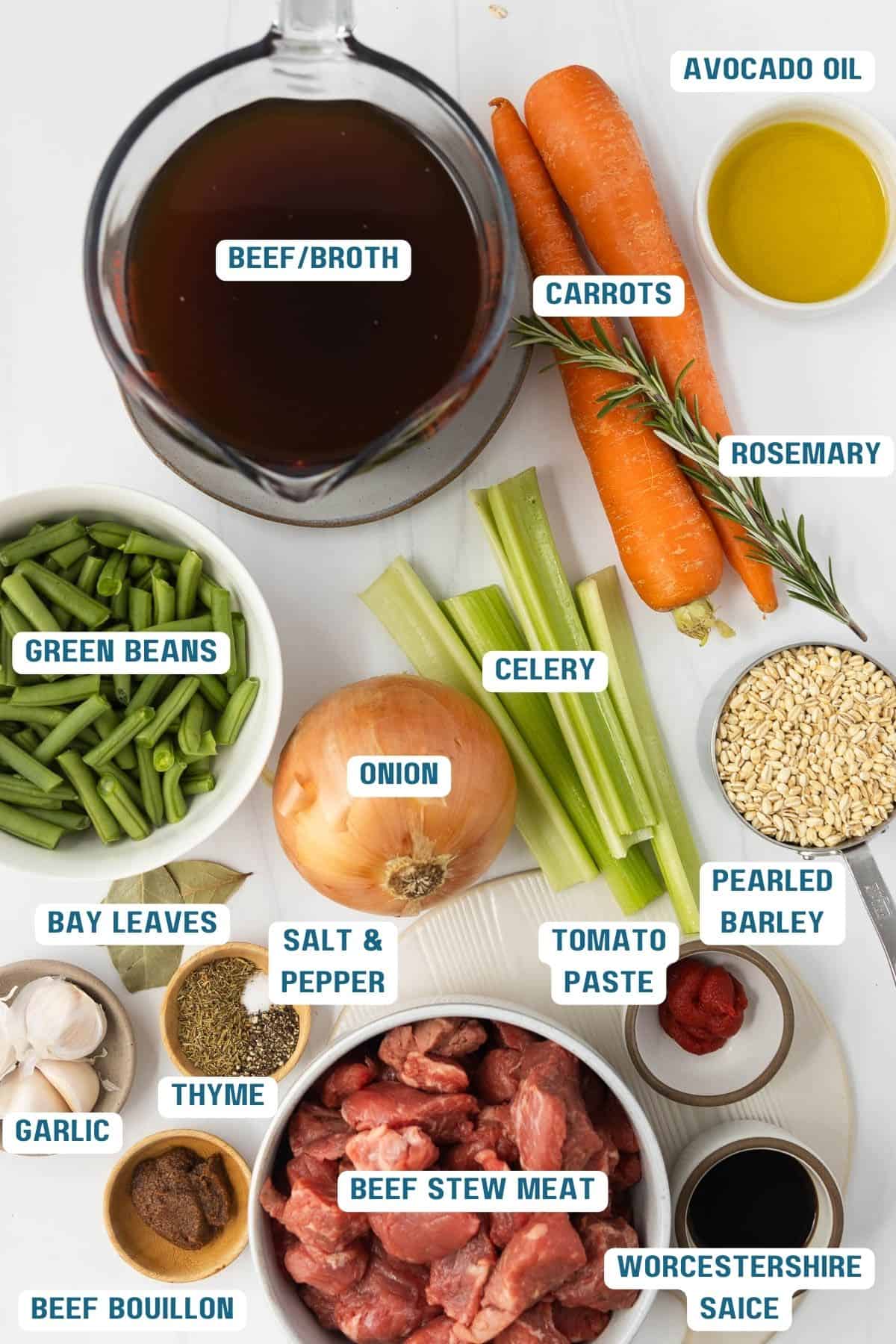 Ingredients to make instant pot beef barley soup on a table.