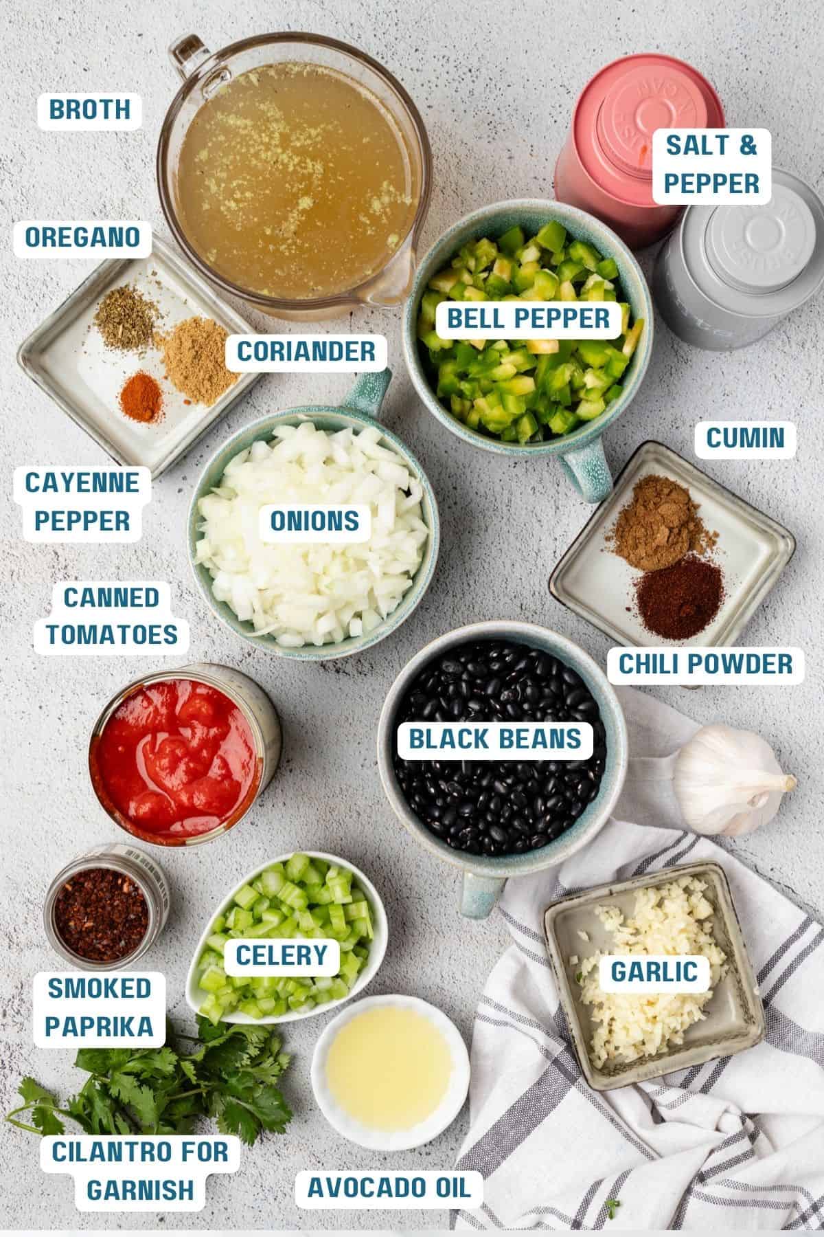 Ingredients to make black bean soup in the instant pot in bowls on the table.