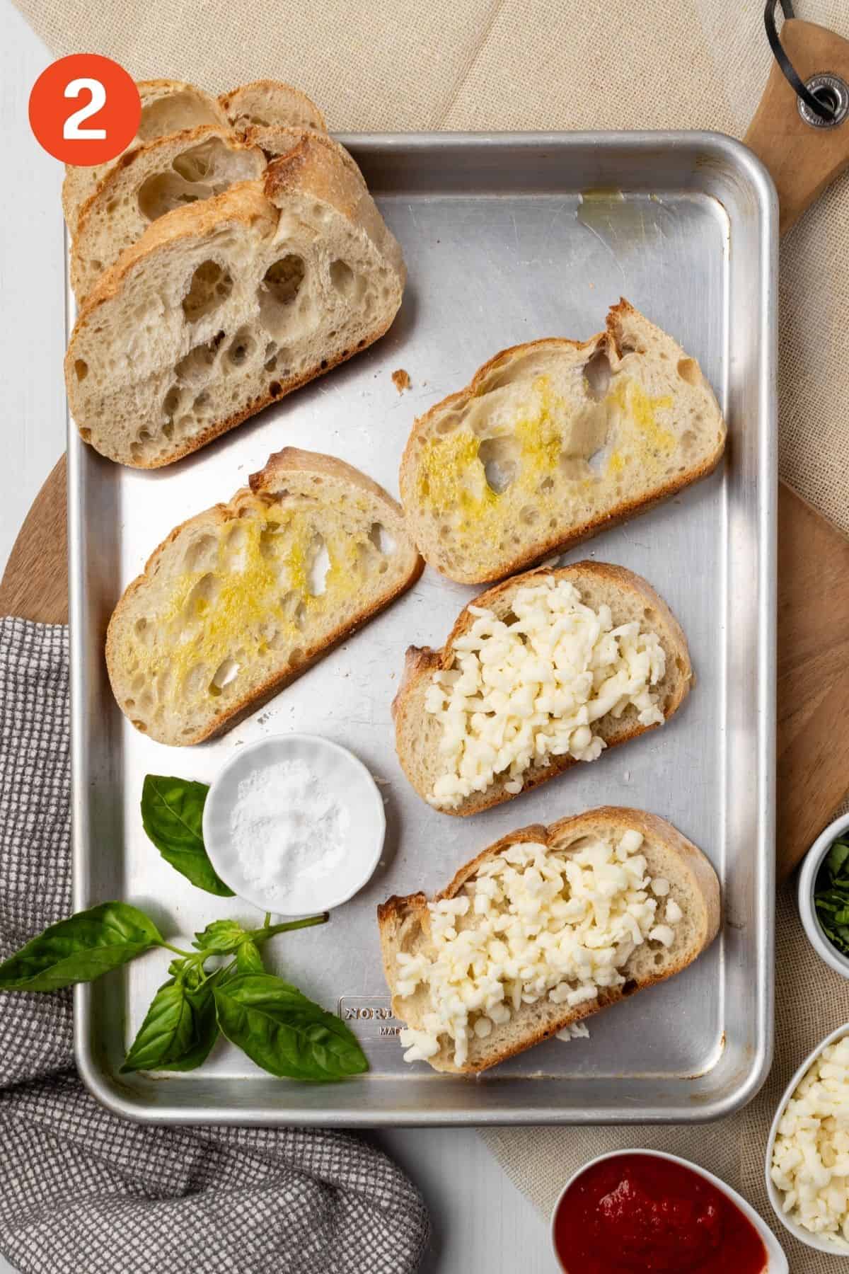 Cheese added to the top of two slices of bread. 