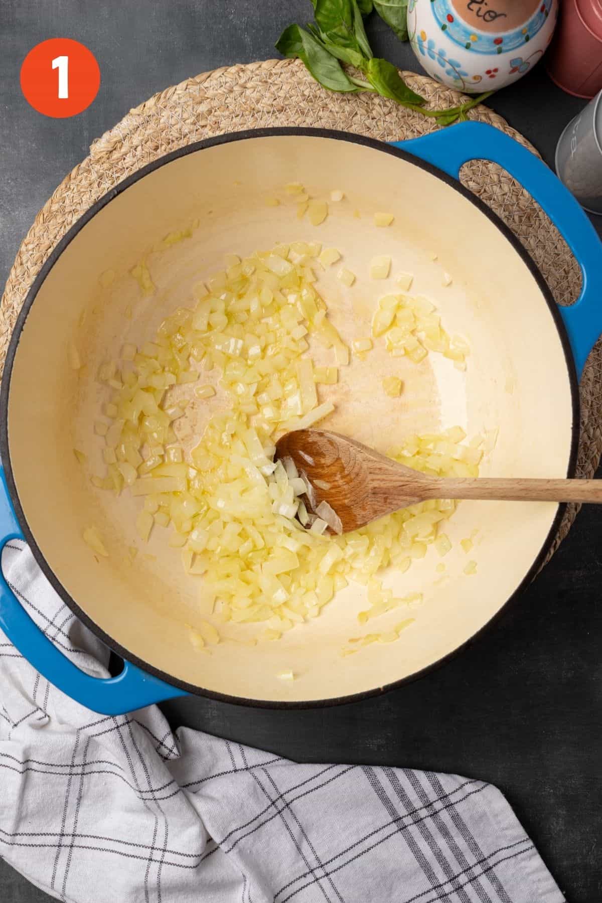 Onions cooking in a Dutch oven. 