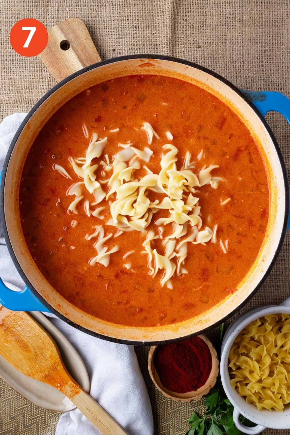 Egg noodles are added to the pot.