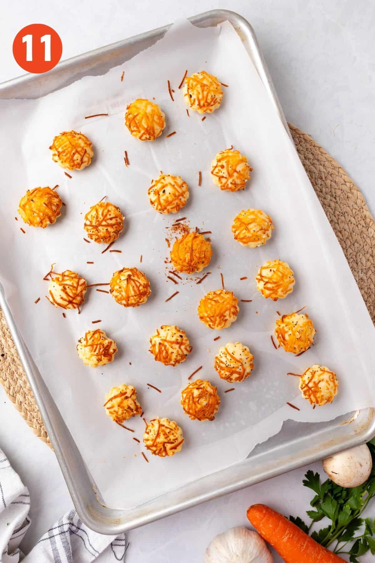 Baked puff pastry cutouts on a baking sheet.
