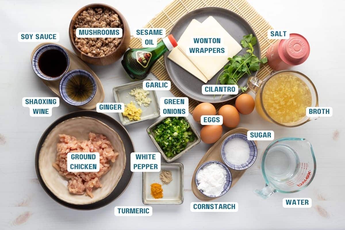 Ingredients to make wonton egg drop soup on the table with labels.