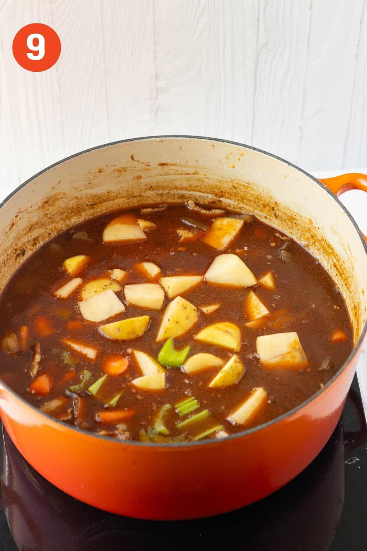Potatoes, celery, and remaining carrots added to the pot.