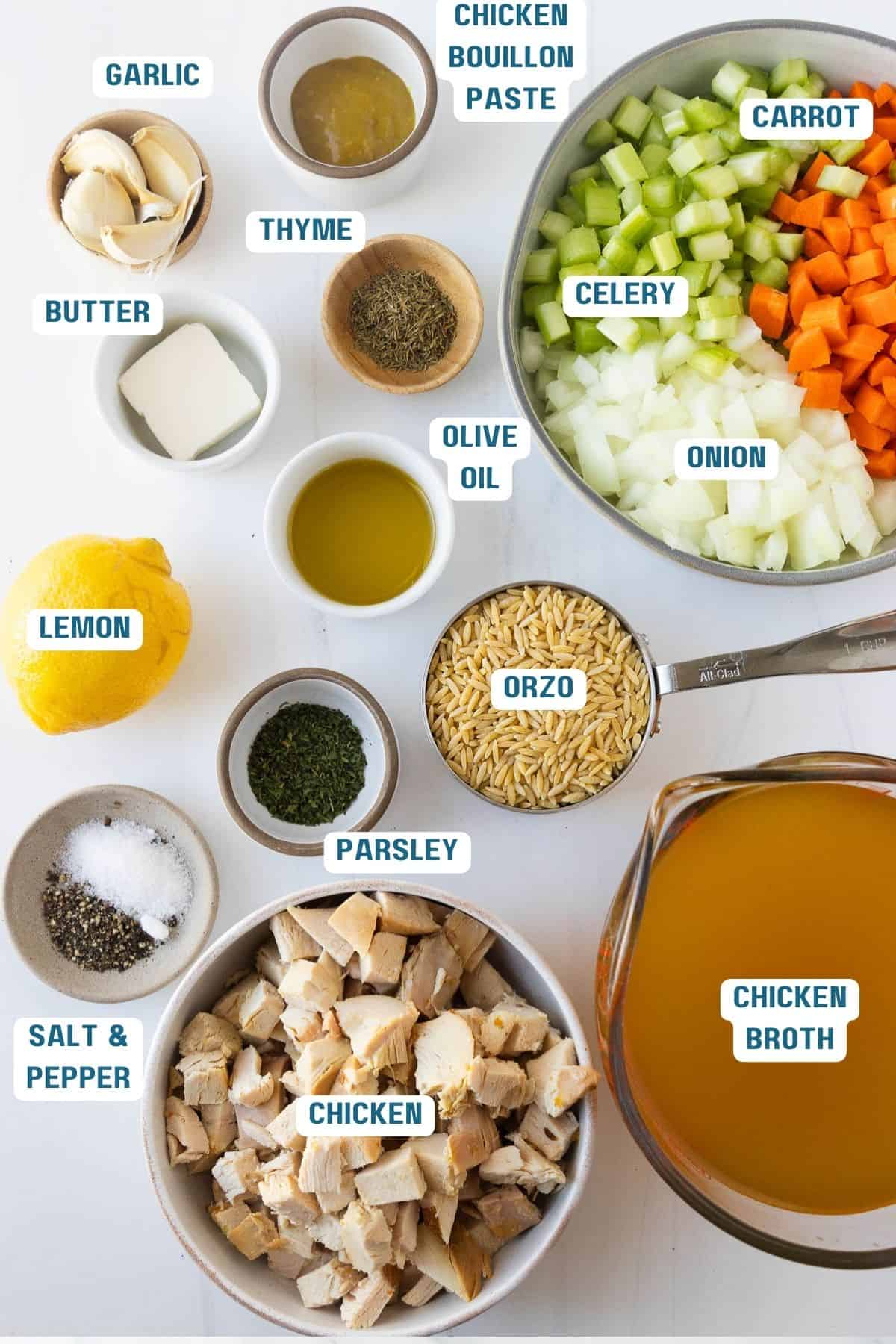 Ingredients to make this chicken orzo soup in bowls on a table.
