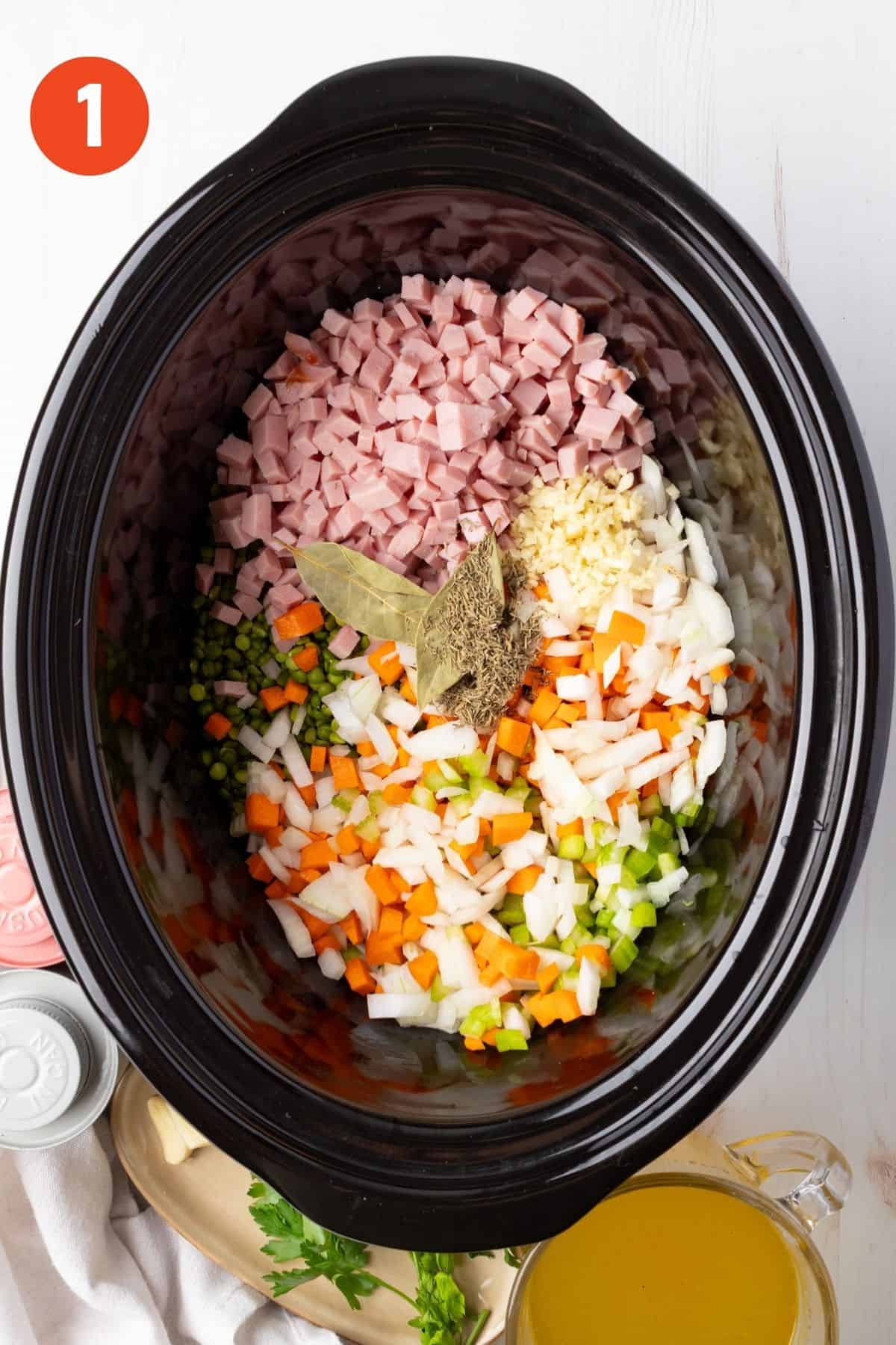 All the ingredients in the slow cooker except for the sweet potatoes.