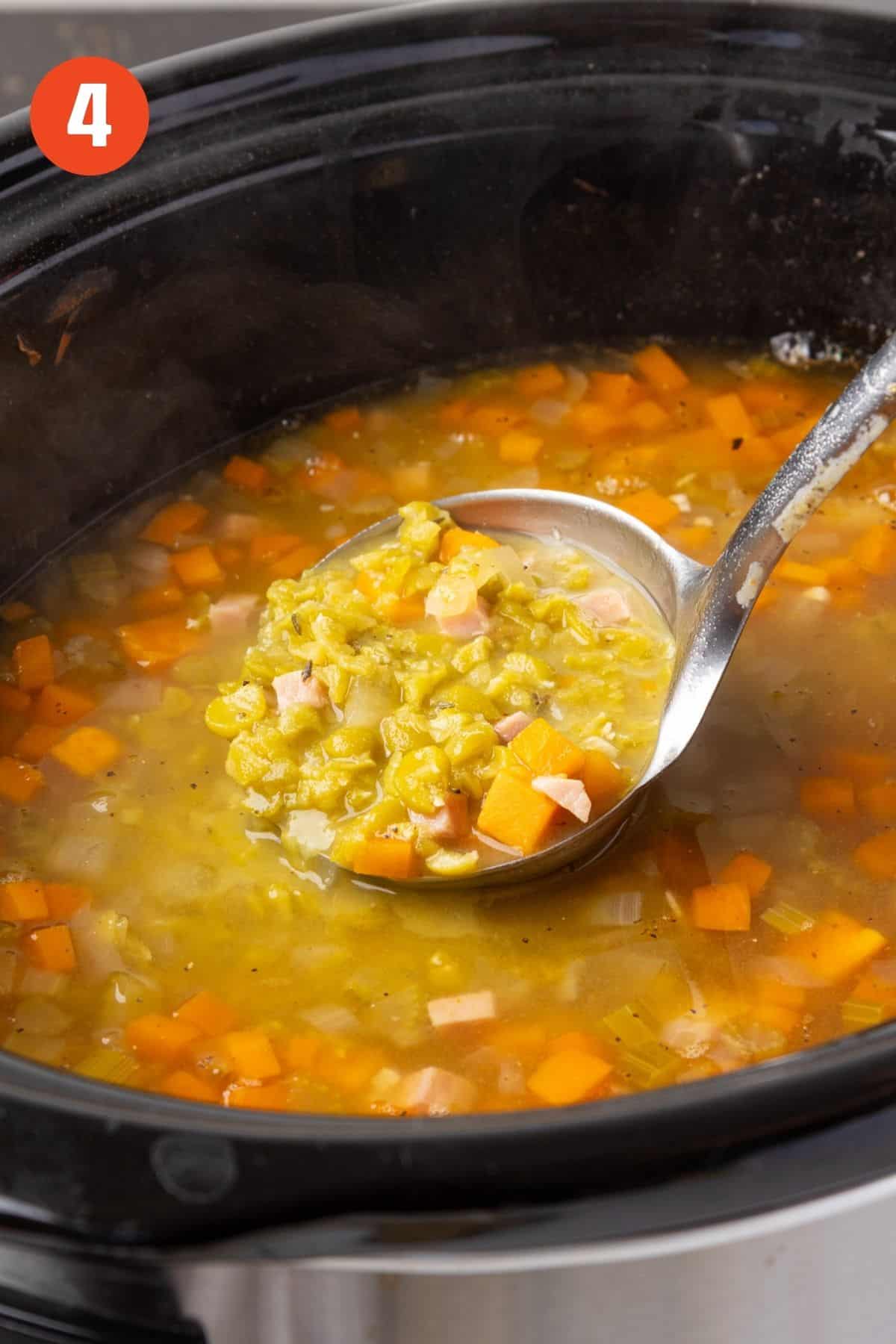A ladle scooping out some soup.