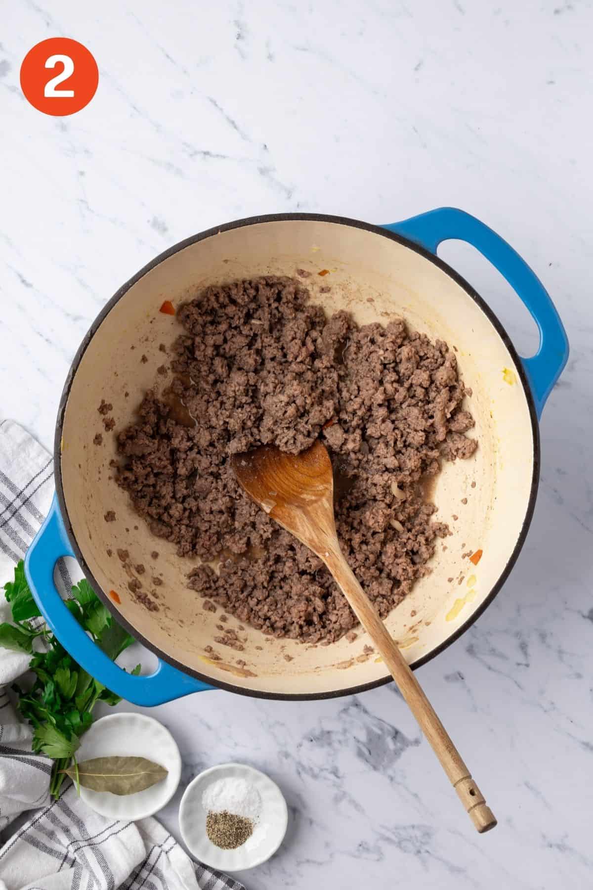 Cooking the ground beef.