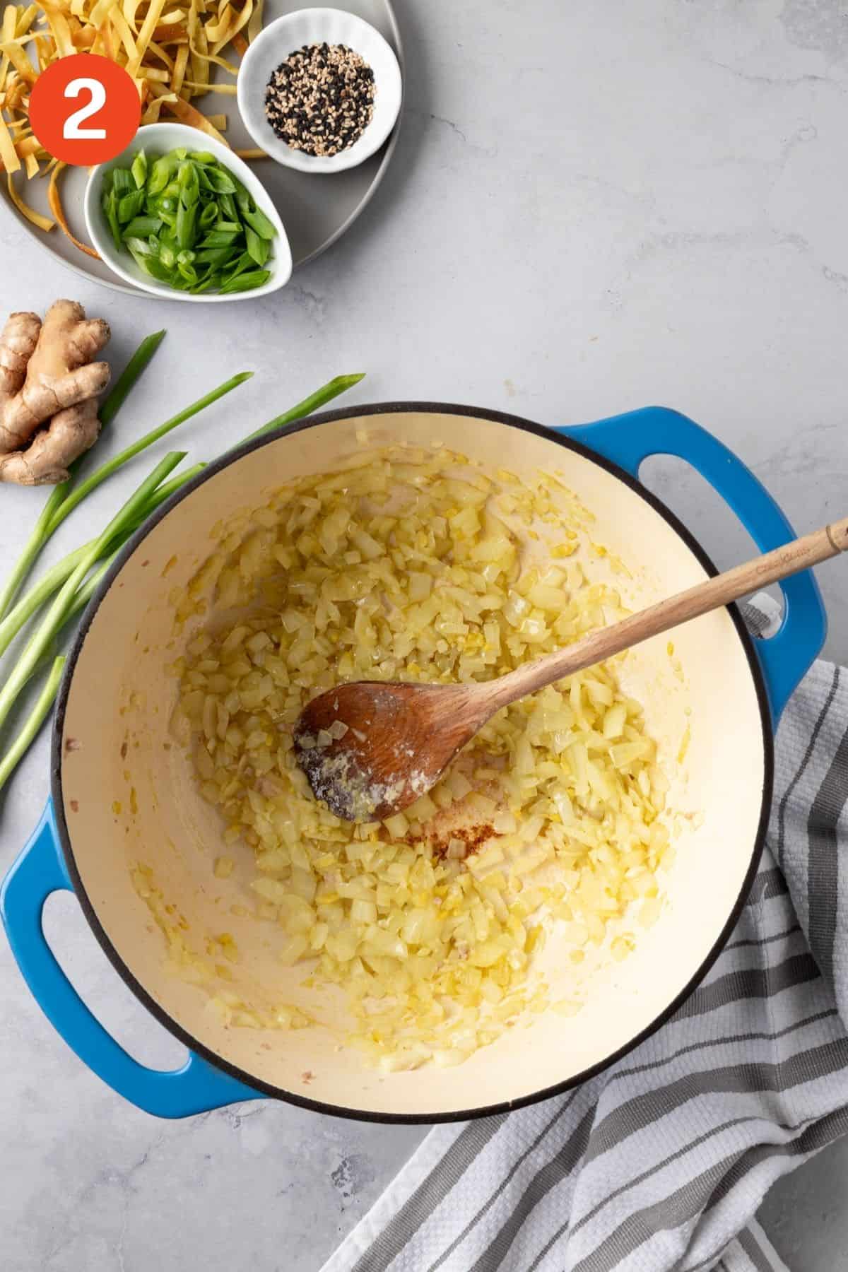 Onion, garlic, and ginger cooking in avocado oil.