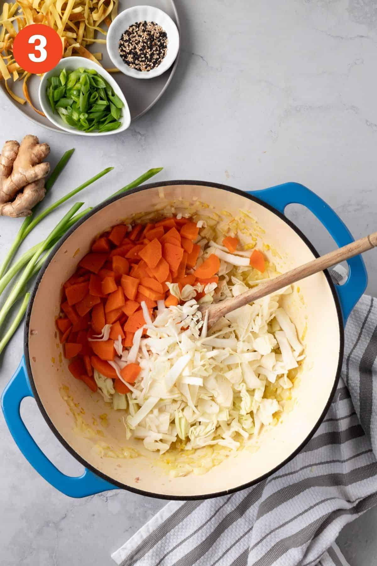 Carrots and cabbage added to the dutch oven.