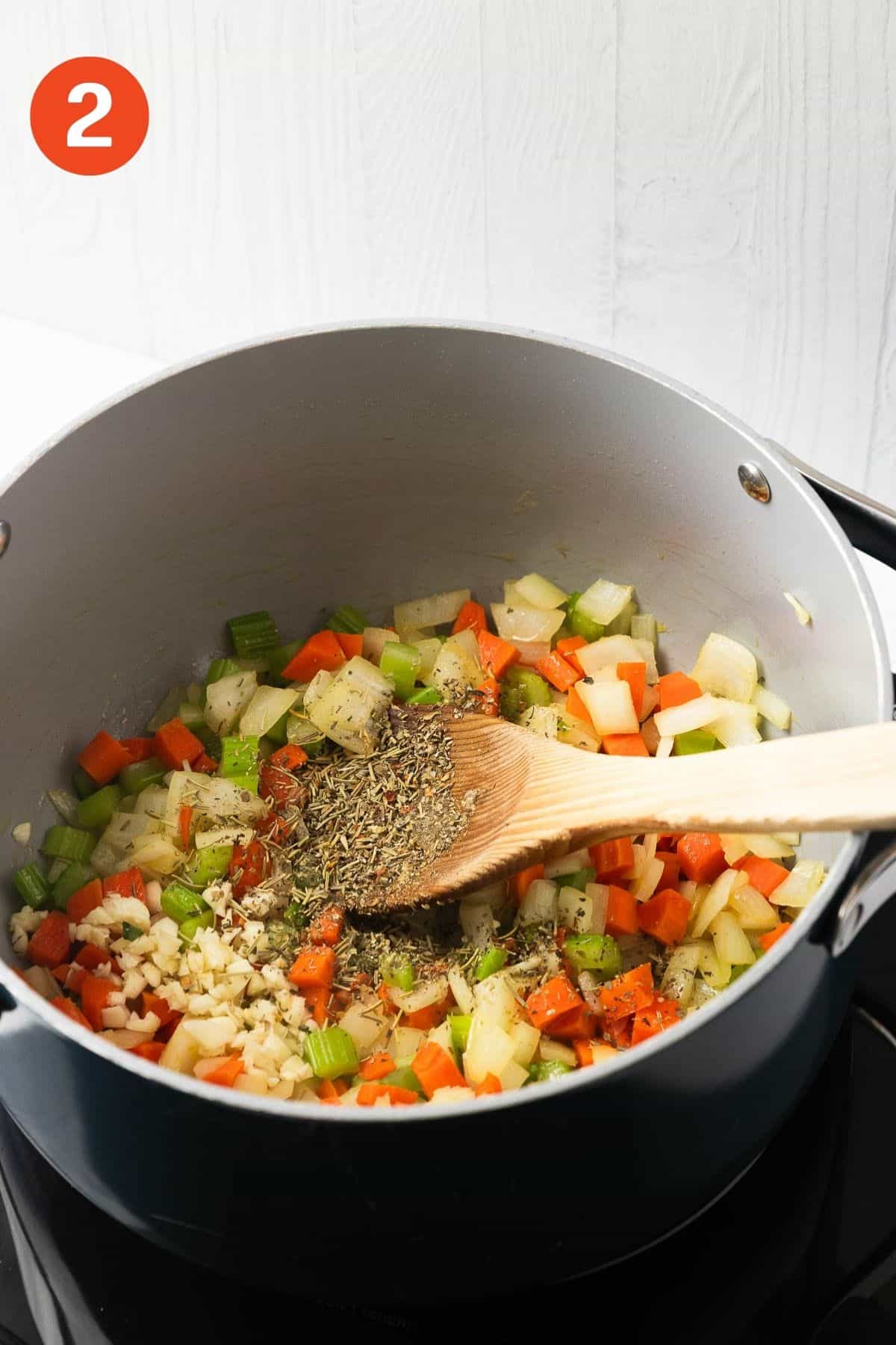 Rosemary, garlic, Italian seasoning, red pepper flakes, and tomato paste added to the pot.