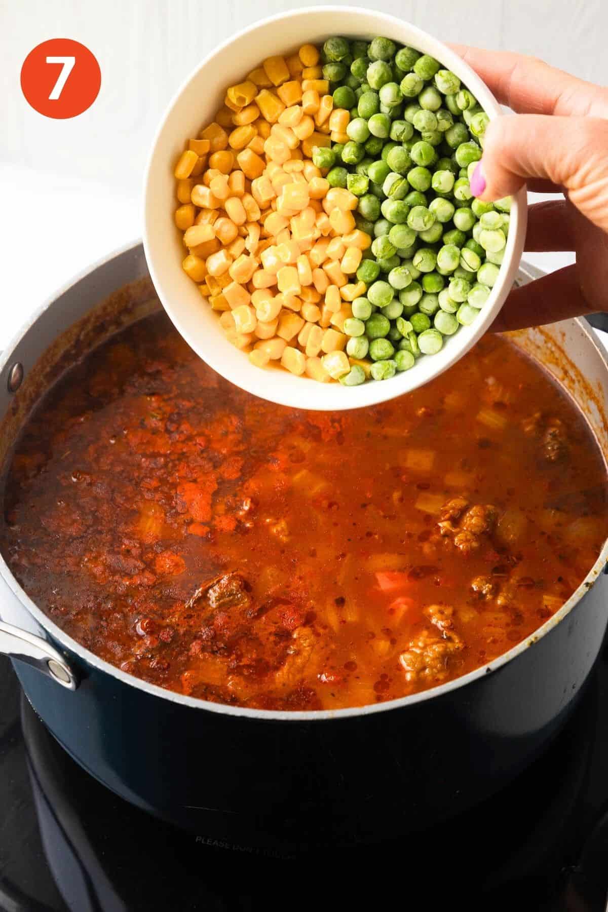 Corn and green peas added to the pot.