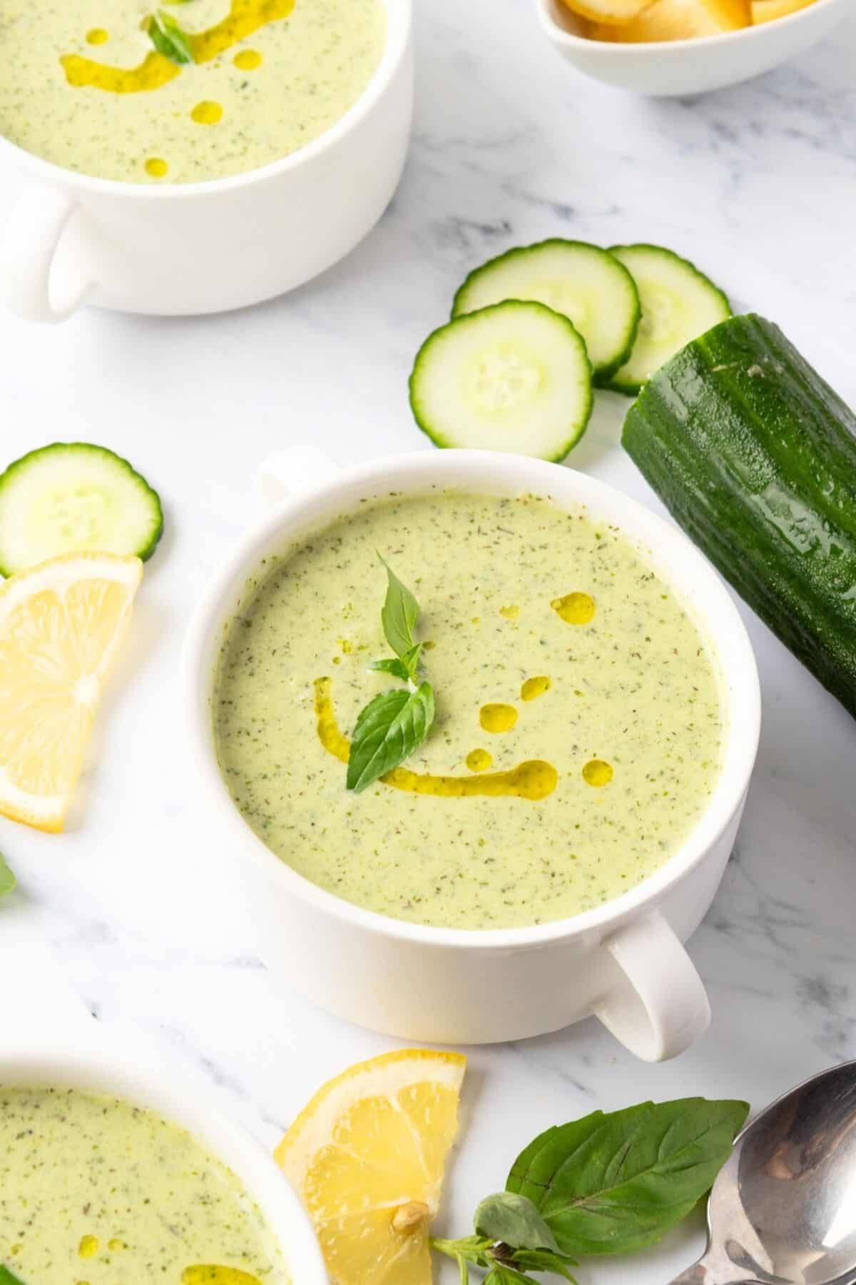 A bowl of chilled cucumber soup with oil on top.
