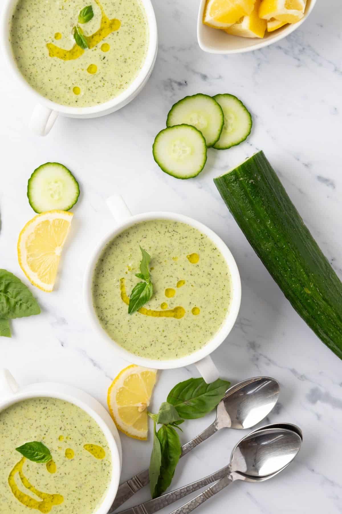 Soup with cucumber in a white bowl.