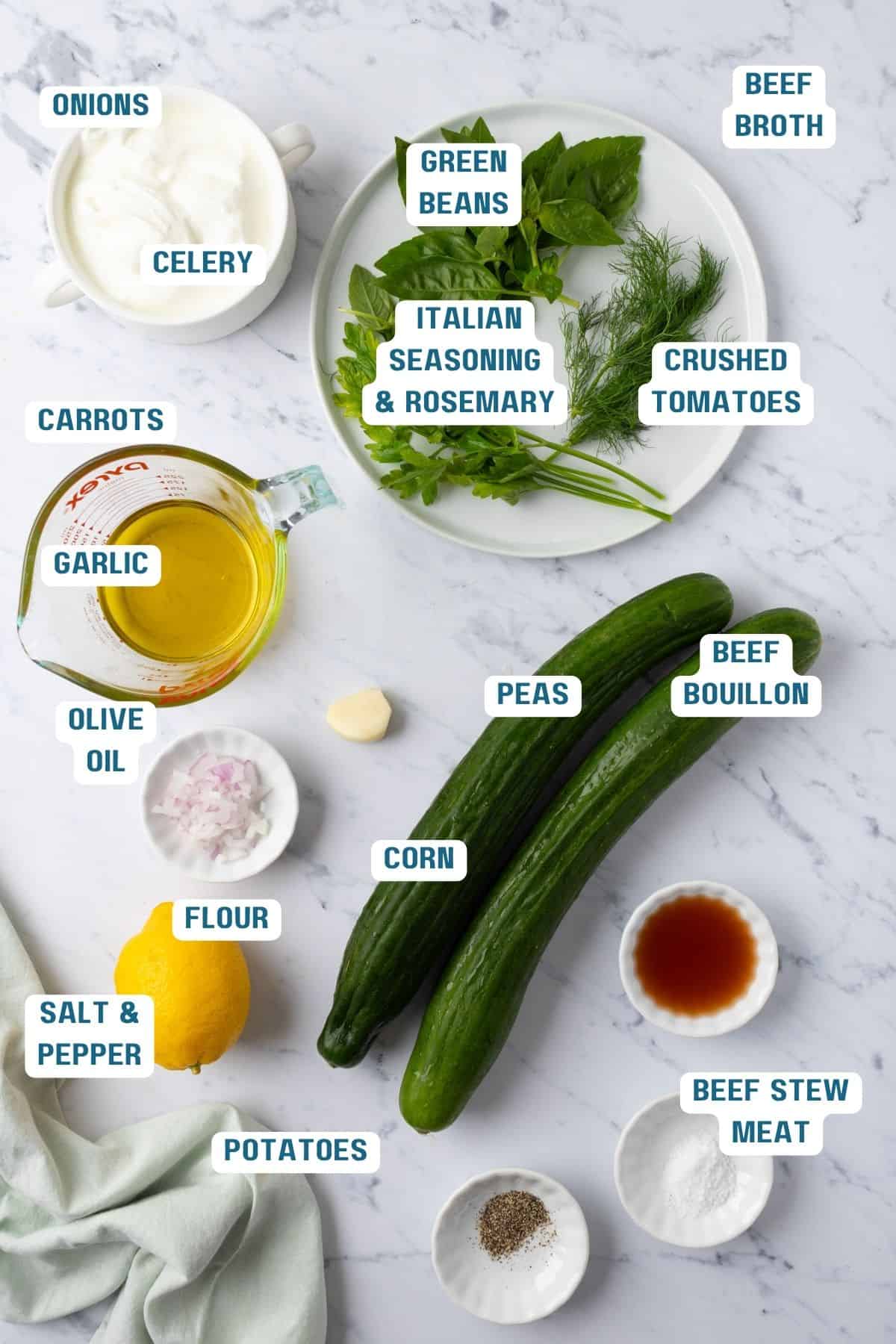 Ingredients to make this cucumber yogurt soup on a table.