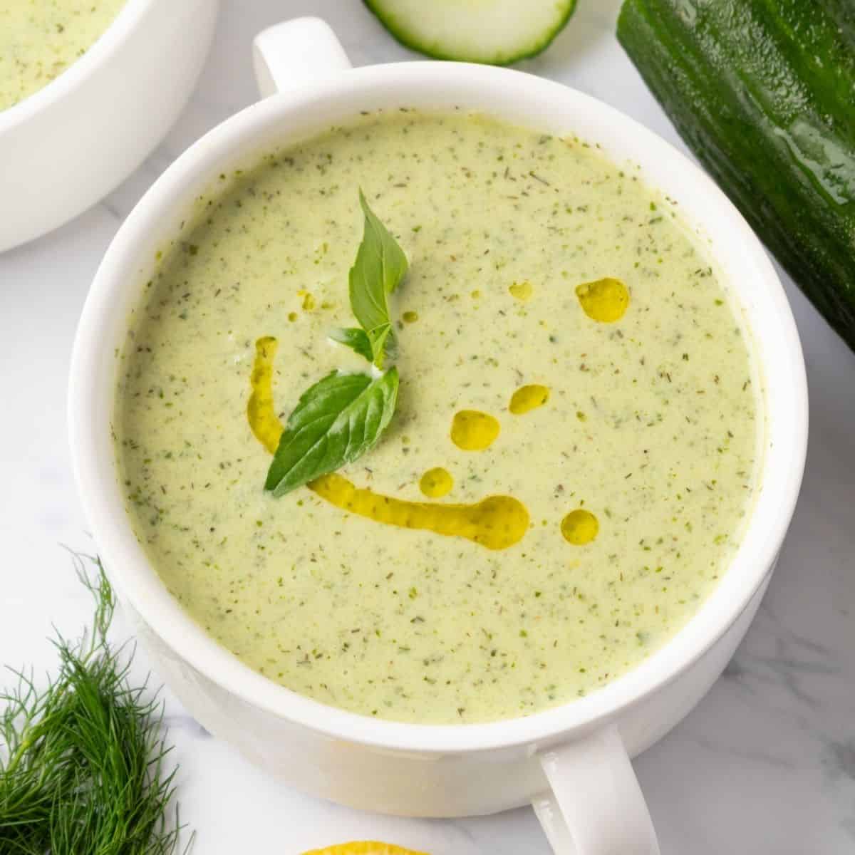 A white bowl of cucumber soup.