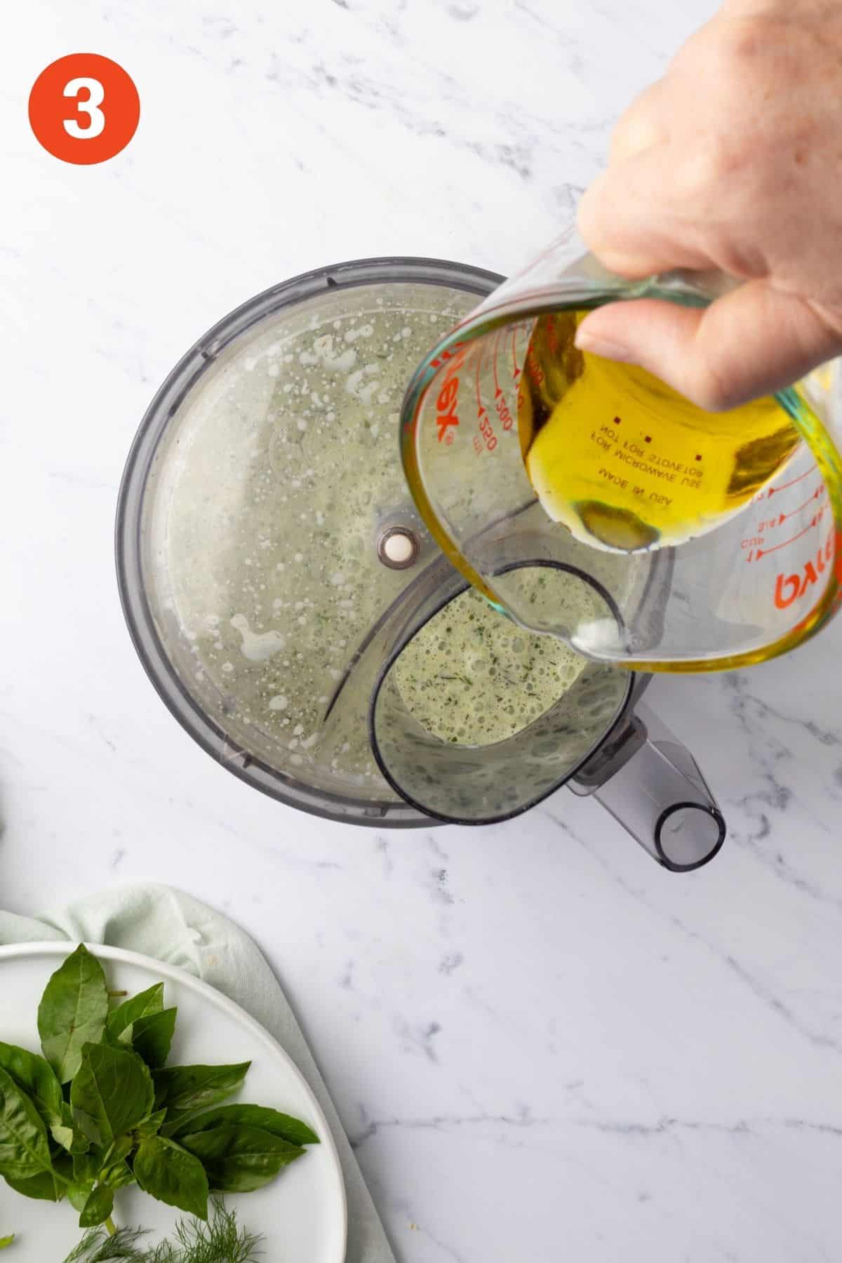 Oil added to the food processor.