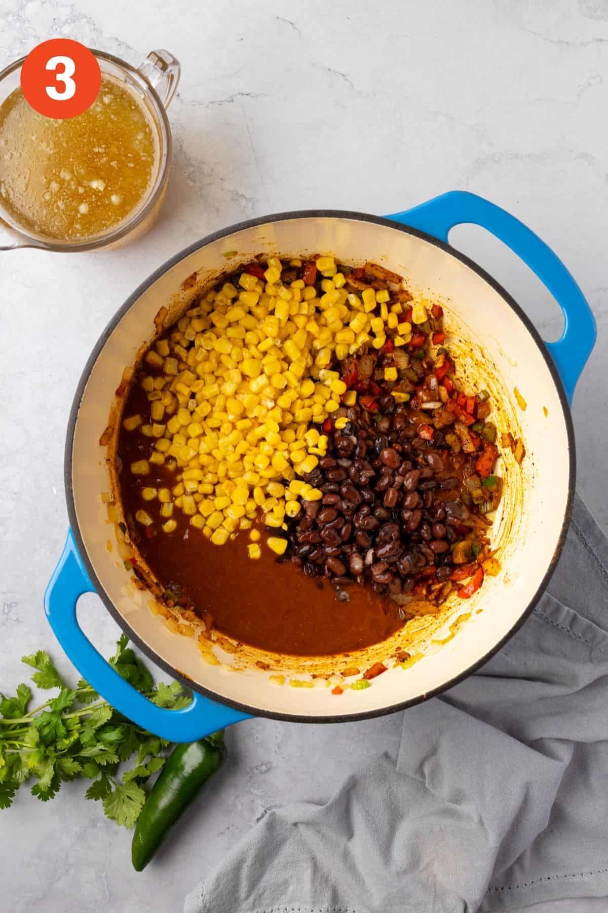 Enchilada sauce, tomatoes, beans, corn, broth, and salt added into the veggies.