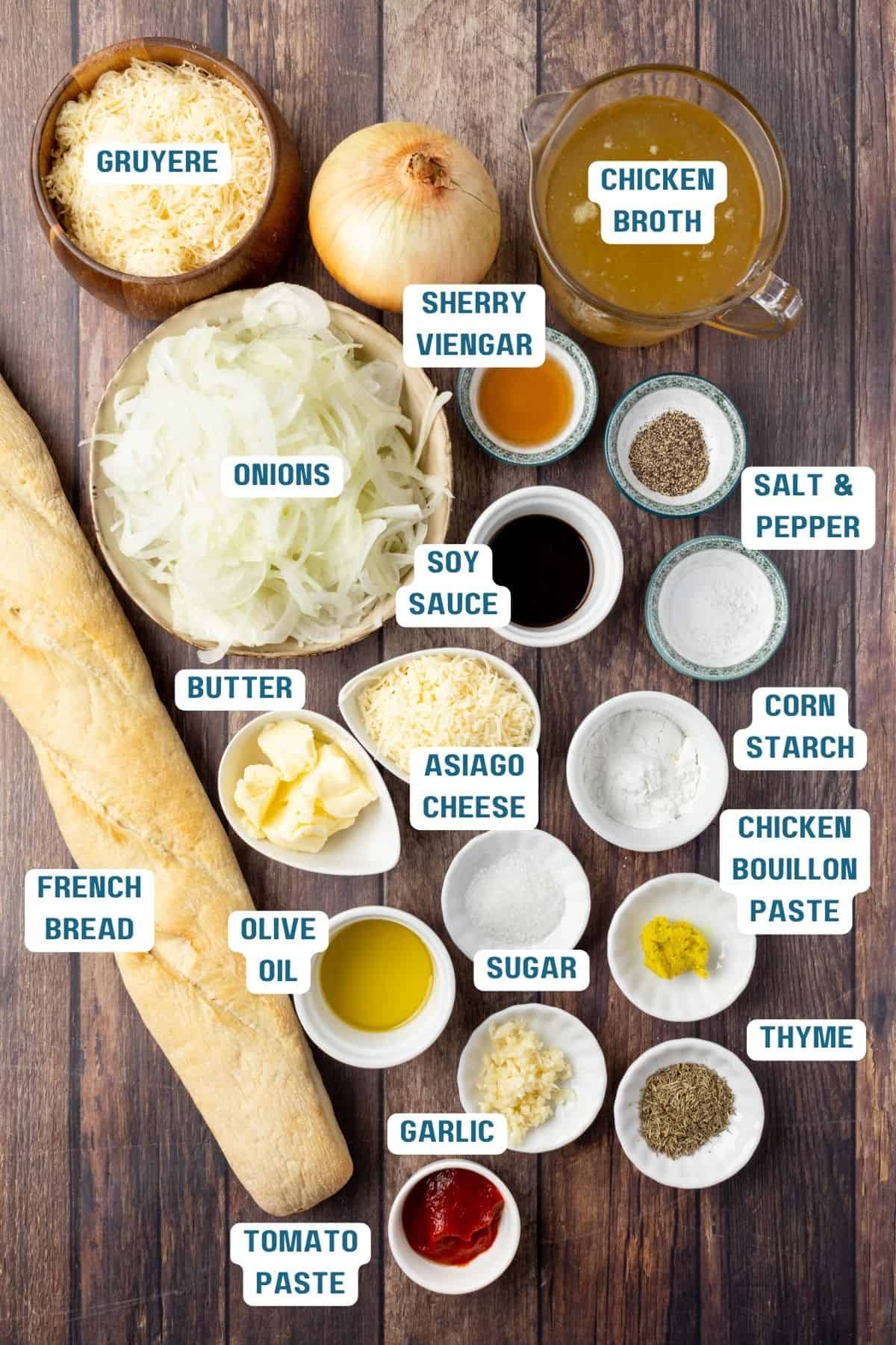 Ingredients to make French onion soup in dishes on a table.