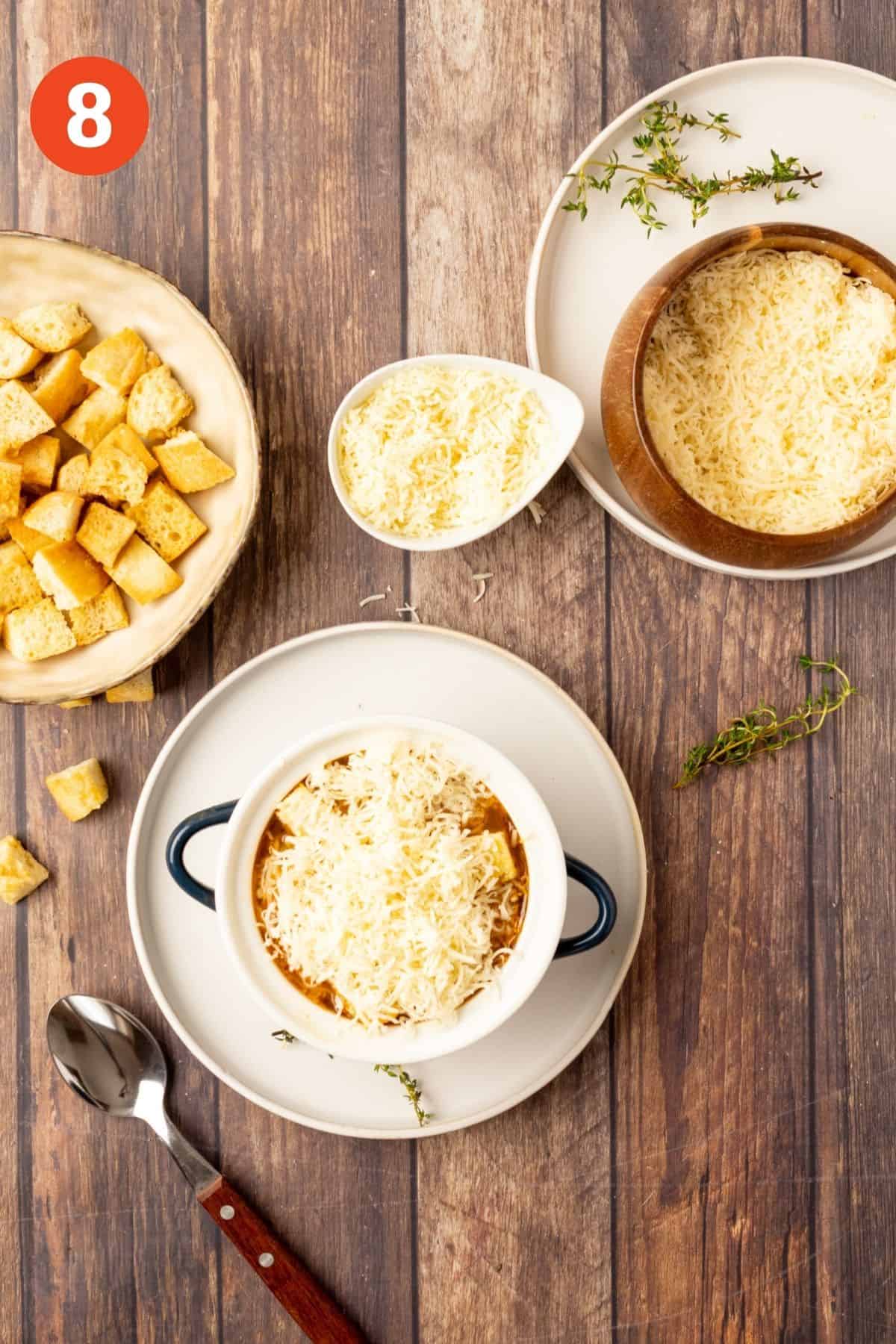 Cheese added on top of the bowl of soup.