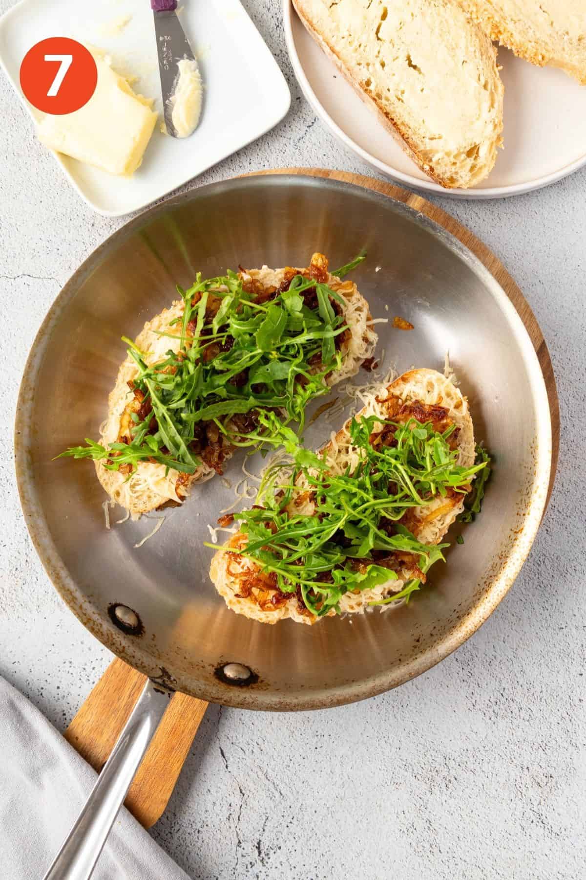 Arugula added to the sandwich.