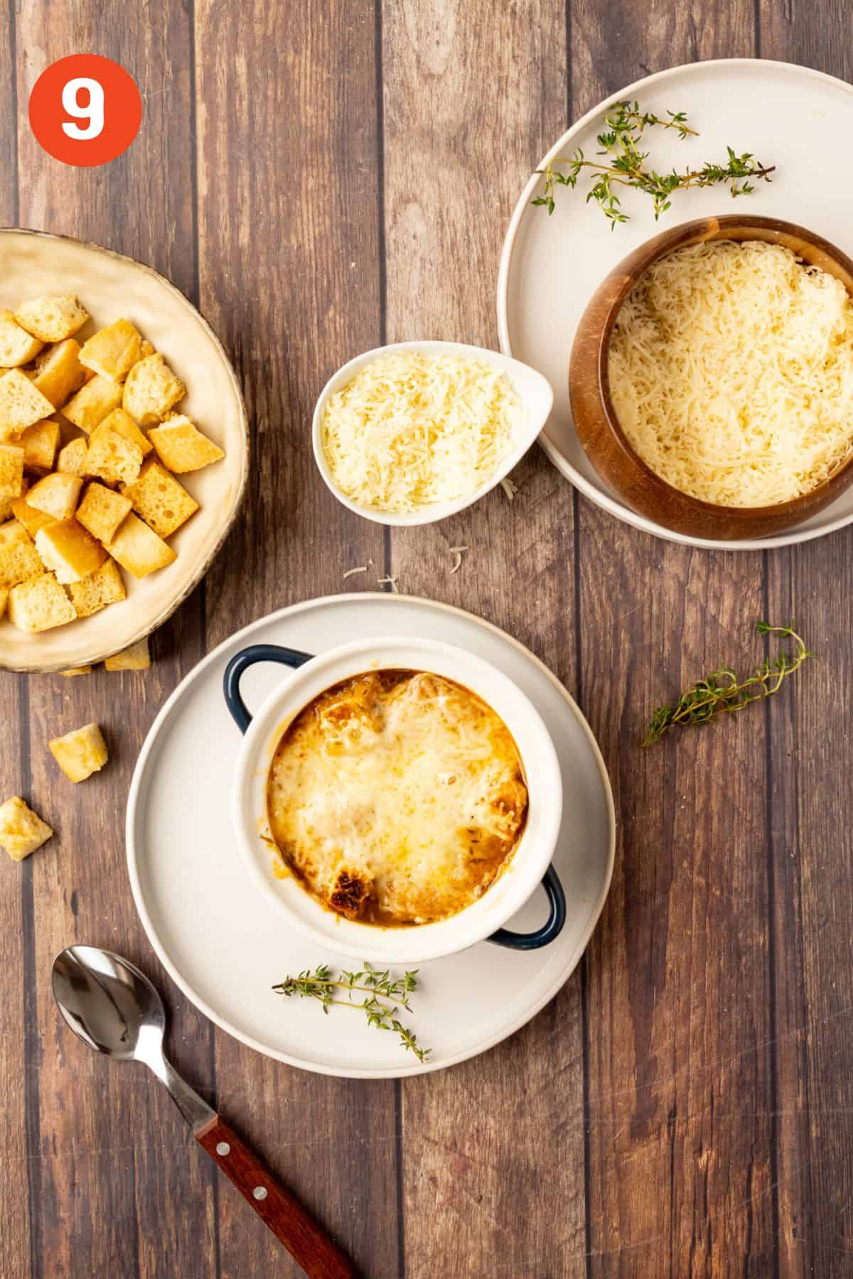 Cheese is melted on top of a bowl of French onion soup.