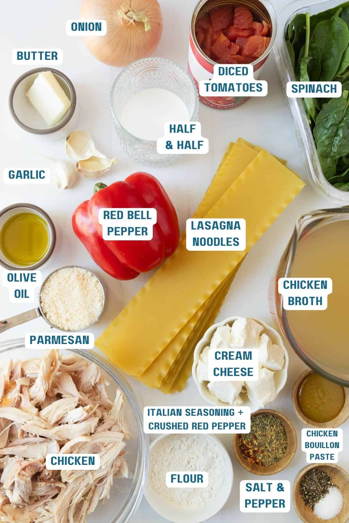 Ingredients to make white chicken lasagna in bowls on a table.
