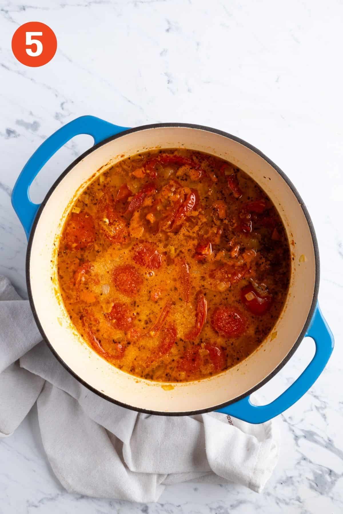 Roasted tomatoes added to the pot.