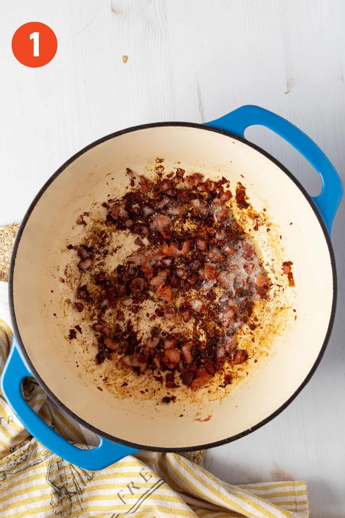 Bacon bits cooking in a pot for creamy potato corn chowder.