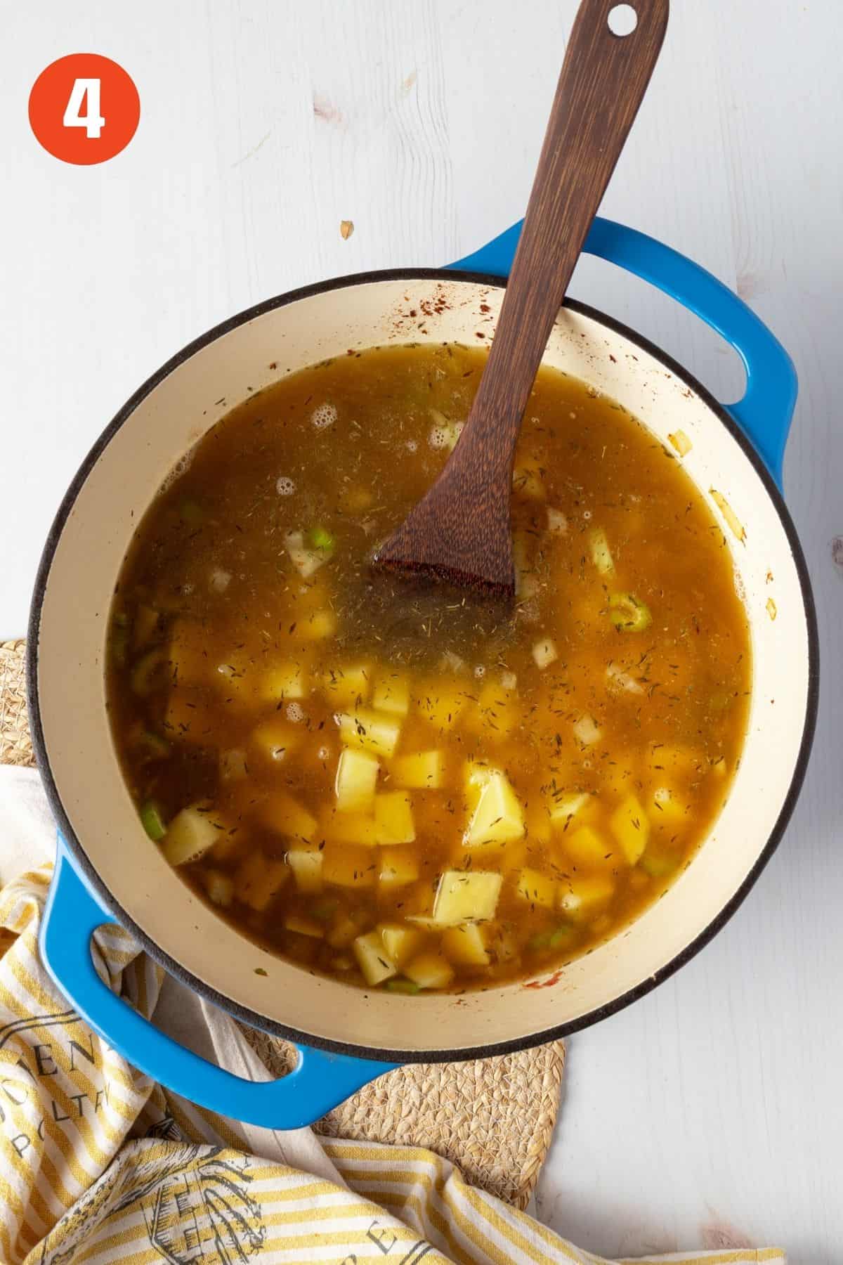 Broth and potatoes added to the pot.
