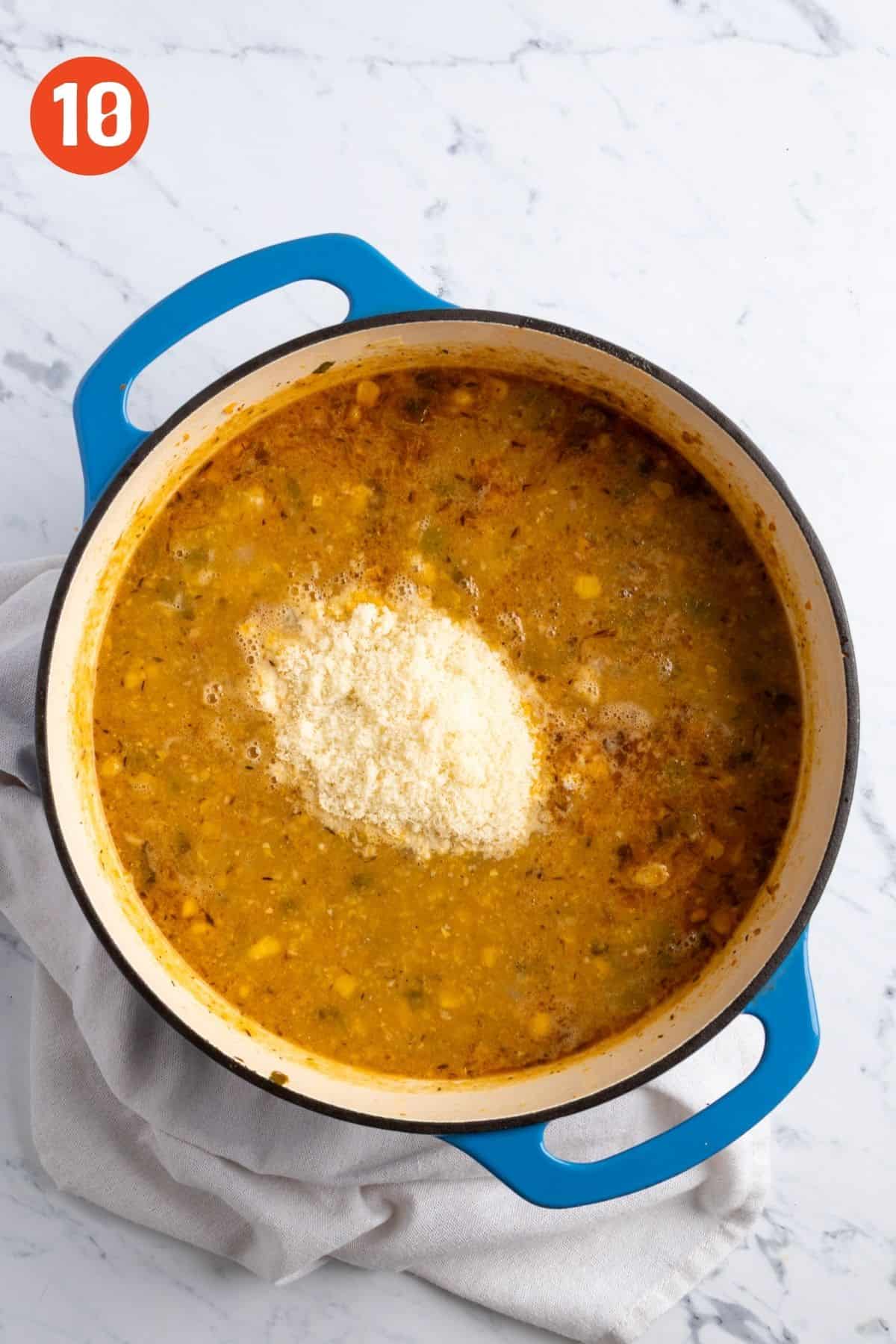 Parmesan cheese added to the pot.