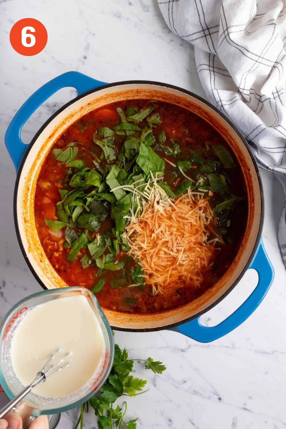 Half-and-half, spinach, and Parmesan stirred into the pot off the heat.